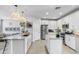 Bright, modern kitchen featuring two islands, stainless steel appliances, and granite countertops at 6338 W Raymond St, Phoenix, AZ 85043
