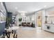 Bright living room featuring modern decor, tile floors, and neutral color palette at 6338 W Raymond St, Phoenix, AZ 85043