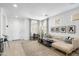 Bright and airy living room with modern decor, featuring a comfortable sectional sofa and decorative artwork at 6338 W Raymond St, Phoenix, AZ 85043