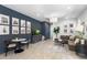 Stylish living room featuring dark accent wall and bright decor at 6338 W Raymond St, Phoenix, AZ 85043