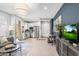 Open-concept living space with tiled floors, stainless appliances, and access to multiple entrances at 6338 W Raymond St, Phoenix, AZ 85043