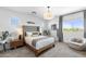 Serene main bedroom boasts a king-size bed, ample natural light, and a cozy seating area at 6338 W Raymond St, Phoenix, AZ 85043