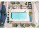 Birds-eye view of a community pool with lounge chairs and manicured landscaping at 64 N 63Rd St # 55, Mesa, AZ 85205