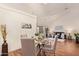 Dining area with seating for four, open to the living room with lots of light at 64 N 63Rd St # 55, Mesa, AZ 85205
