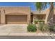 Charming home boasts a two-car garage, neatly manicured landscaping, and a welcoming entrance at 64 N 63Rd St # 55, Mesa, AZ 85205
