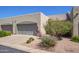 Charming home boasts a two-car garage, neatly manicured landscaping, and a welcoming entrance at 64 N 63Rd St # 55, Mesa, AZ 85205