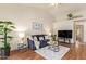 Bright living room with hardwood floors, sliding glass doors, and a ceiling fan at 64 N 63Rd St # 55, Mesa, AZ 85205