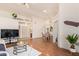 Bright living room features hardwood floors, high ceilings, and neutral decor at 64 N 63Rd St # 55, Mesa, AZ 85205