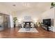 Bright living room with hardwood floors, sliding glass doors, and a ceiling fan at 64 N 63Rd St # 55, Mesa, AZ 85205