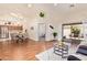 Spacious open-concept living area with wood floors and access to the patio at 64 N 63Rd St # 55, Mesa, AZ 85205