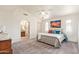 Bright main bedroom with en-suite bathroom and a ceiling fan at 64 N 63Rd St # 55, Mesa, AZ 85205