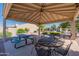 Community covered patio featuring picnic tables and seating, a perfect spot for residents to relax and socialize at 64 N 63Rd St # 55, Mesa, AZ 85205