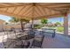 Community covered patio featuring picnic tables and seating, a perfect spot for residents to relax and socialize at 64 N 63Rd St # 55, Mesa, AZ 85205