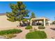 Lush landscaping frames a community patio, with shady trees and greenery enhancing the inviting outdoor space at 64 N 63Rd St # 55, Mesa, AZ 85205