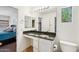 Bathroom featuring granite counters, white cabinetry, and an adjacent bedroom at 7501 S 14Th St, Phoenix, AZ 85042
