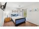Cozy bedroom with a comfortable bed, side table, and decorative wall art, creating a welcoming space at 7501 S 14Th St, Phoenix, AZ 85042