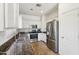 Modern kitchen featuring granite countertops, stainless steel appliances, and white cabinets, for a stylish look at 7501 S 14Th St, Phoenix, AZ 85042