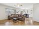 Open-concept living room features a ceiling fan and access to an outdoor living space at 7501 S 14Th St, Phoenix, AZ 85042