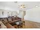 Open-concept living room features a ceiling fan and access to the dining area at 7501 S 14Th St, Phoenix, AZ 85042