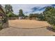 Well-maintained backyard featuring decorative rock groundcover, mature trees, and storage shed at 828 E Le Marche Ave, Phoenix, AZ 85022