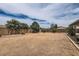 Large, open backyard featuring gravel groundcover and block wall fencing at 828 E Le Marche Ave, Phoenix, AZ 85022