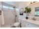 Modern bathroom featuring walk-in shower, neutral walls, vanity, and updated mirror and lighting at 828 E Le Marche Ave, Phoenix, AZ 85022