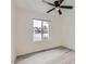 Neutral bedroom featuring modern ceiling fan, view through window and gray vinyl flooring at 828 E Le Marche Ave, Phoenix, AZ 85022