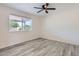 Bright and airy bedroom featuring gray vinyl flooring and a window providing ample natural light at 828 E Le Marche Ave, Phoenix, AZ 85022