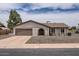 Charming single-story home featuring a well-maintained front yard and attached garage with a wide driveway at 828 E Le Marche Ave, Phoenix, AZ 85022