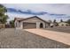 Lovely single-story home with a long driveway and an attached two-car garage at 828 E Le Marche Ave, Phoenix, AZ 85022