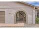 Close-up of the front door with an archway and decorative wreath, adding a touch of elegance at 828 E Le Marche Ave, Phoenix, AZ 85022