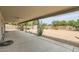 Covered patio with fans, open backyard with plants and a storage shed at 828 E Le Marche Ave, Phoenix, AZ 85022