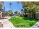 Spacious backyard featuring a pool, slide, putting green, spiral staircase and lush landscaping at 8464 N 7Th Ave, Phoenix, AZ 85021
