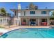 A lovely in-ground pool with a slide and diving board, complemented by the home at 8464 N 7Th Ave, Phoenix, AZ 85021