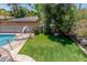 Backyard featuring an in-ground pool and putting green at 8464 N 7Th Ave, Phoenix, AZ 85021
