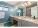 Bathroom featuring dual sinks with ample counter space and a large mirror at 8464 N 7Th Ave, Phoenix, AZ 85021