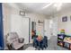 Cozy bedroom with gray carpeting, ceiling fan, closet, and play area for  at 8464 N 7Th Ave, Phoenix, AZ 85021