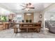 Open dining area with large table, fireplace, and seamless transition to the living room and kitchen at 8464 N 7Th Ave, Phoenix, AZ 85021