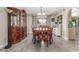 Formal dining room featuring a large wooden table, chairs, built-in china cabinet, and neutral walls at 8464 N 7Th Ave, Phoenix, AZ 85021