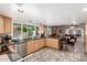 Open kitchen showcasing granite counters, stainless steel appliances, and a breakfast bar at 8464 N 7Th Ave, Phoenix, AZ 85021