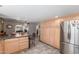 Bright, open kitchen with a granite-topped island and stainless steel appliances, flowing into dining and living areas at 8464 N 7Th Ave, Phoenix, AZ 85021