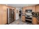Modern kitchen with stainless steel appliances, light wood cabinetry, and convenient layout at 8464 N 7Th Ave, Phoenix, AZ 85021