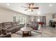Inviting living room with plush seating, a ceiling fan, and seamless access to the backyard at 8464 N 7Th Ave, Phoenix, AZ 85021