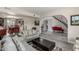 Spacious living room with open view to dining area and staircase, featuring tile flooring at 8464 N 7Th Ave, Phoenix, AZ 85021