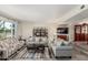 Bright living room featuring tile floors, ample seating, and abundant natural light at 8464 N 7Th Ave, Phoenix, AZ 85021