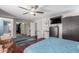 Primary bedroom displays hardwood floors, walk-in closet, and ceiling fan at 8464 N 7Th Ave, Phoenix, AZ 85021