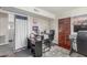 Functional office space with dark wood desk, storage and ample natural light at 8464 N 7Th Ave, Phoenix, AZ 85021