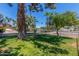 Home situated near well-maintained landscaping and lush greenery for community appeal at 8464 N 7Th Ave, Phoenix, AZ 85021
