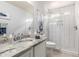 Modern bathroom featuring subway tile, glass shower, and granite vanity at 864 S 223Rd Ln, Buckeye, AZ 85326