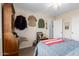 Neutral bedroom featuring vintage desk and military-themed decor for a distinctive style at 864 S 223Rd Ln, Buckeye, AZ 85326